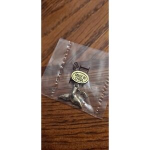 Gold-tone Whale Tale Charm from Diamonds International